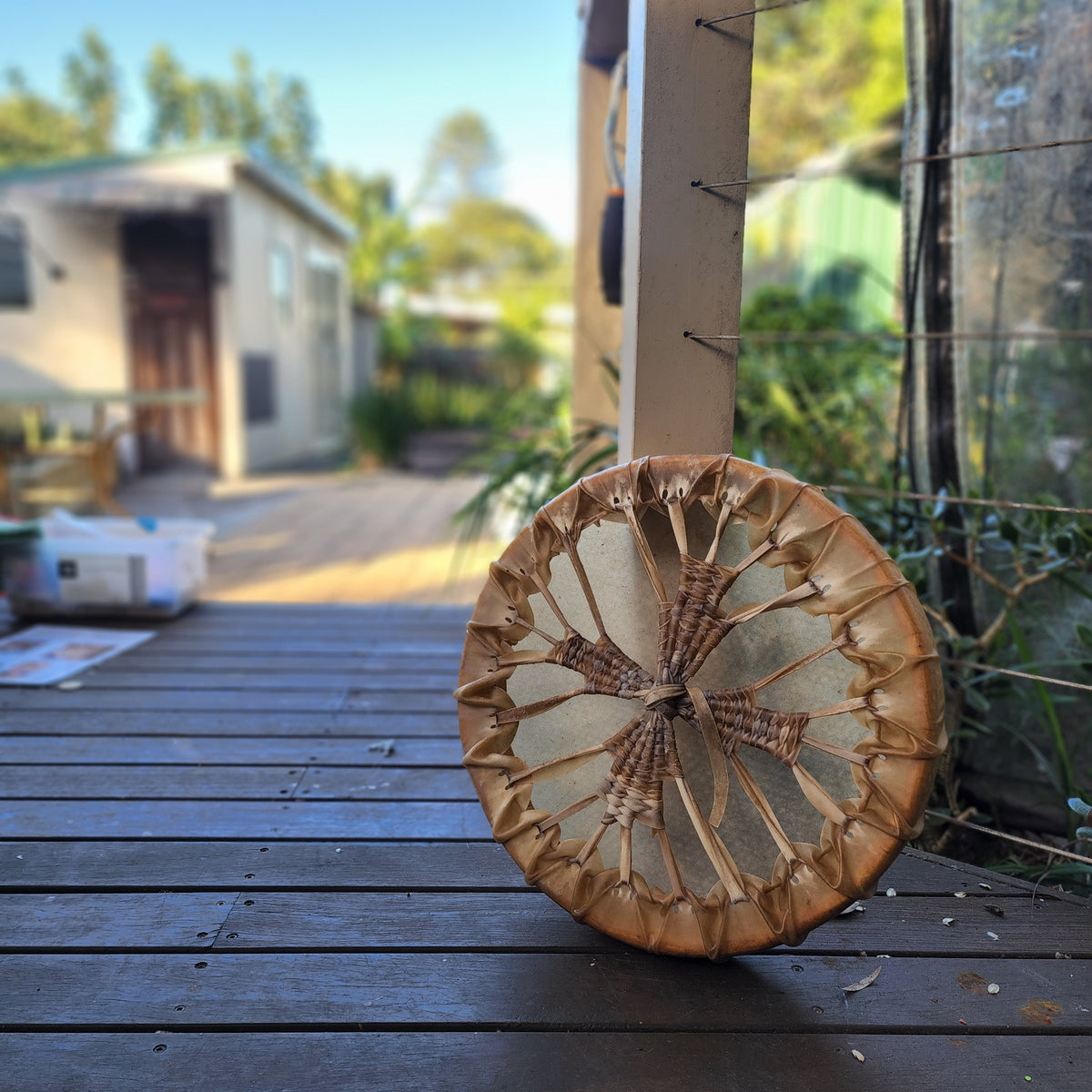 A finished medicine drum resting on the deck