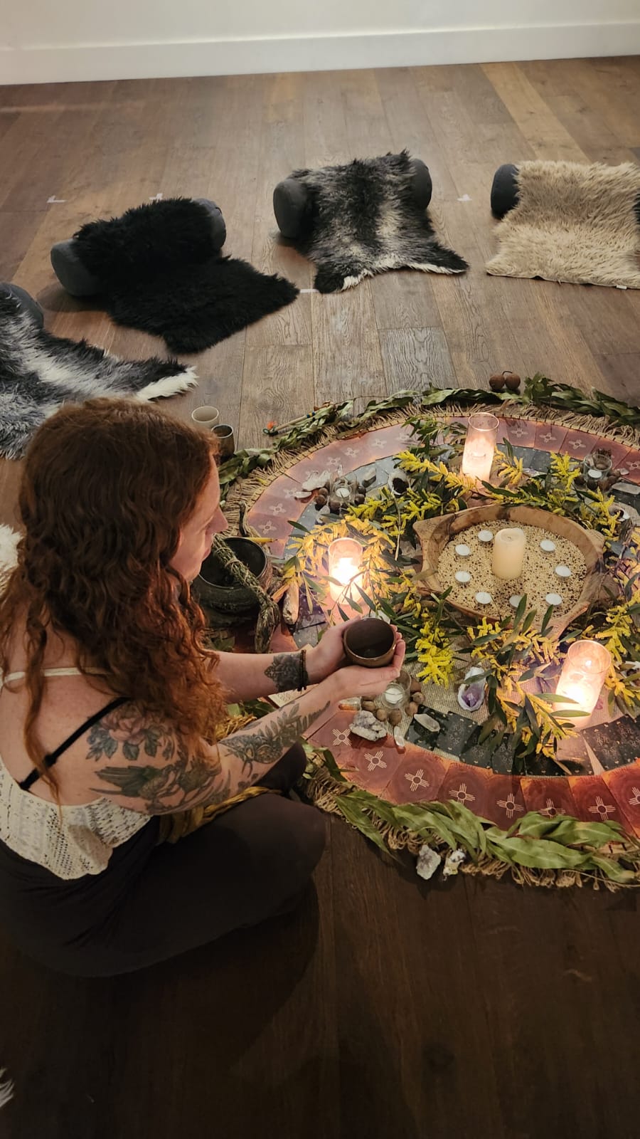 An earth mandala laid around a fire