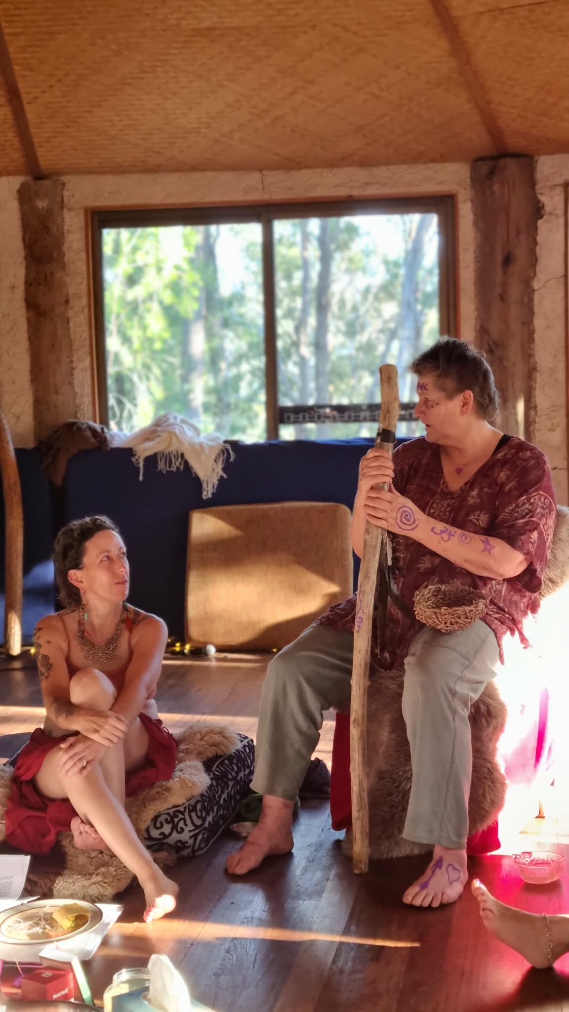 Gypsy Willow Artemis and an elder friend sitting together in ceremony