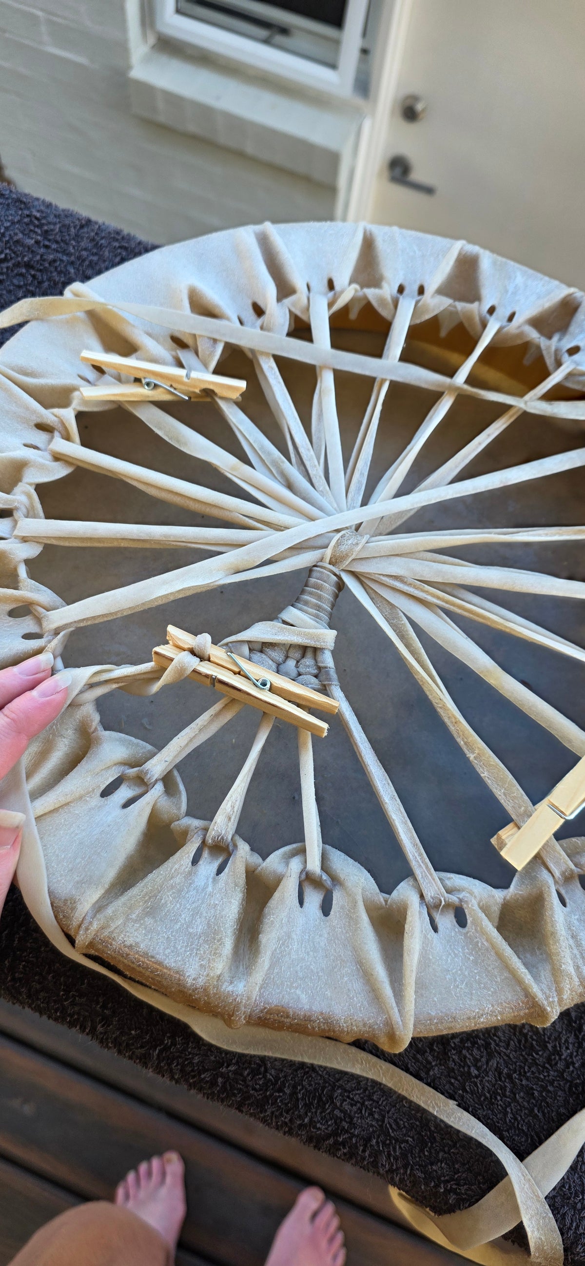 Lacing a medicine drum outdoors